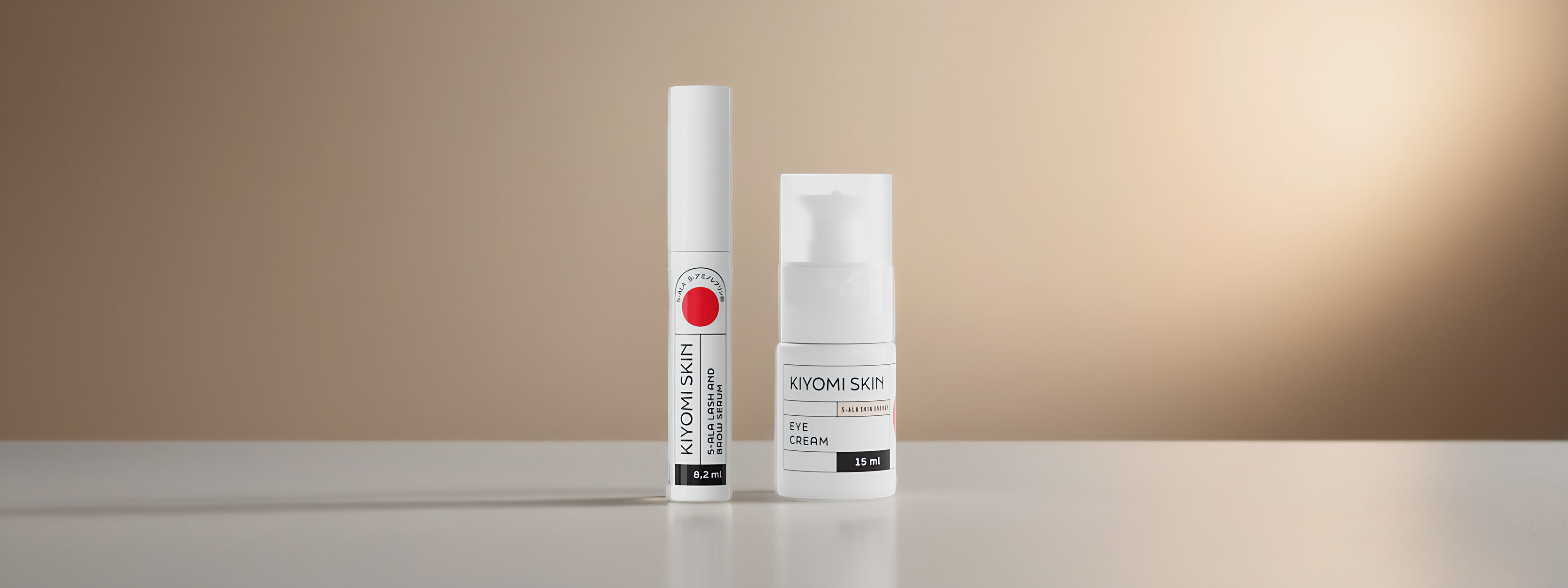 Two Kiyomi Skin products, a serum and an eye cream, are displayed on a smooth beige surface.